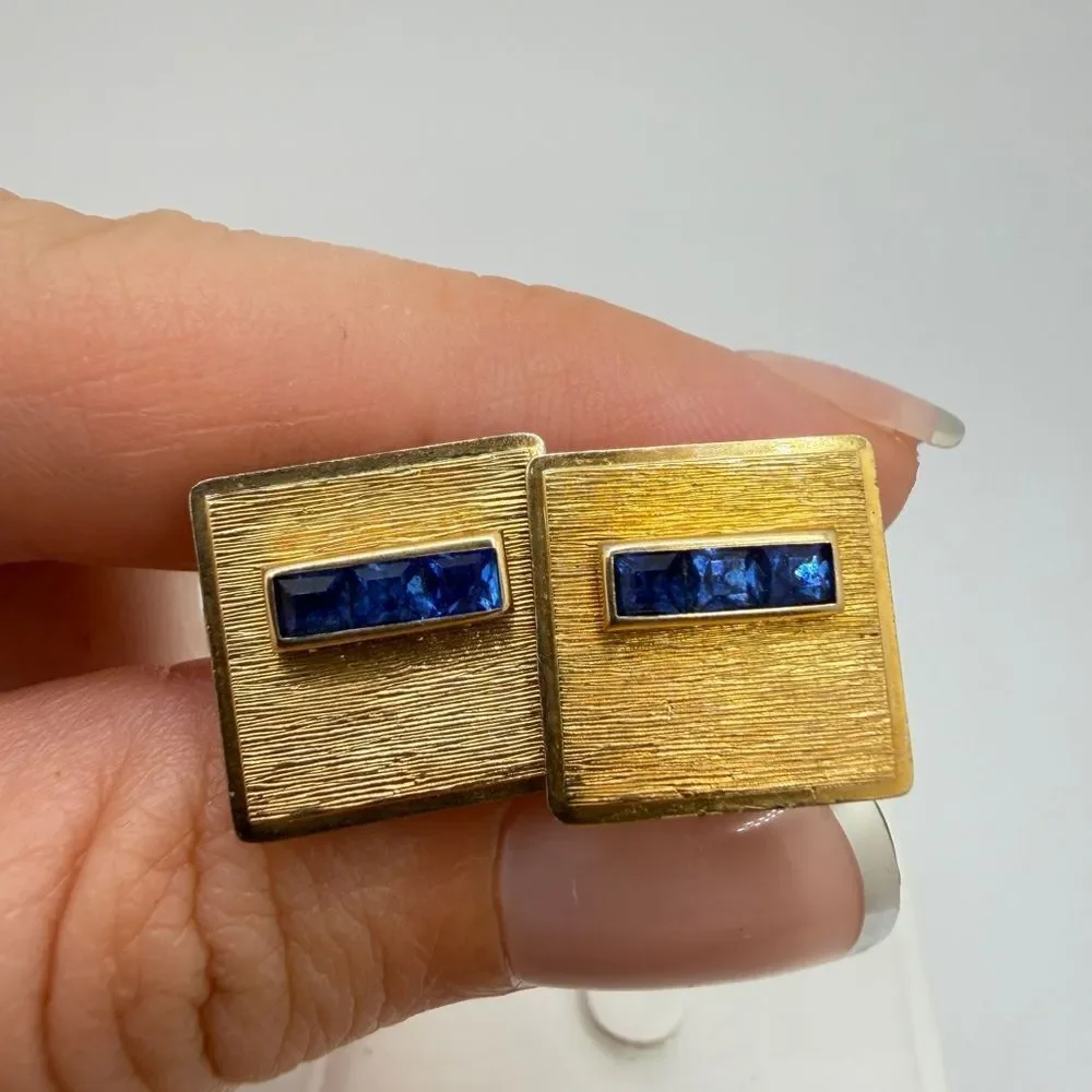 Vintage Krementz Gold tone cuff likes with princess cut blue rhinestone accents!